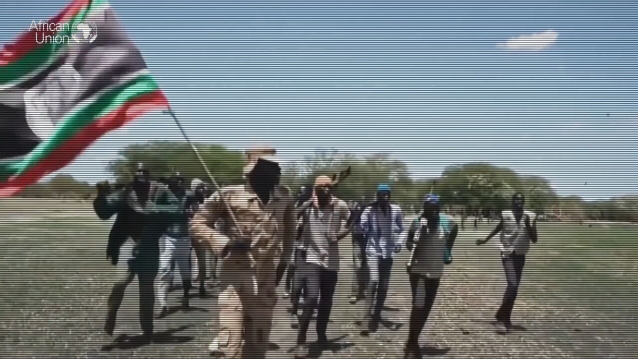 Protesters marching with a flag