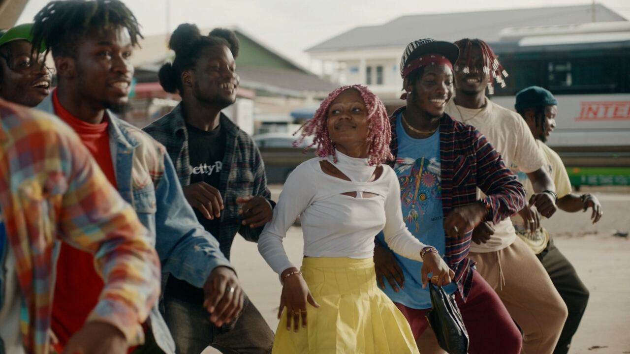 Young people dancing in a city street