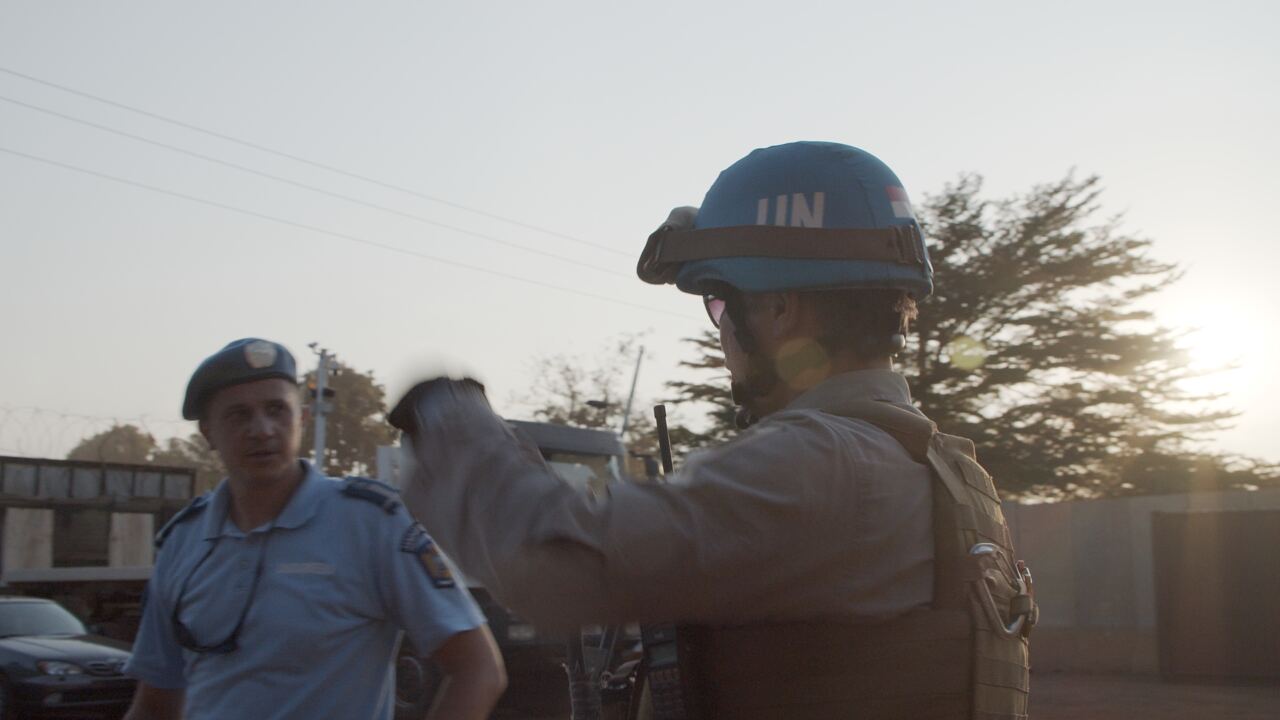 UN peacekeepers and police at a street checkpoint