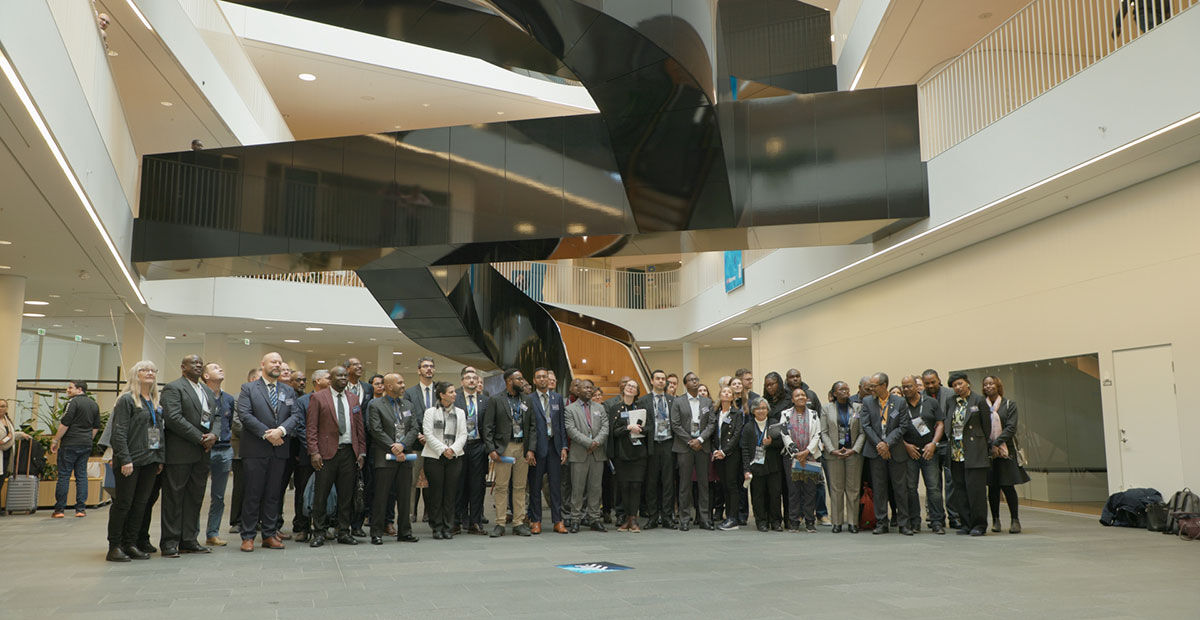 Delegates at the Blue Justice Conference 2023 gathered for a group photograph at UN City, Copenhagen
