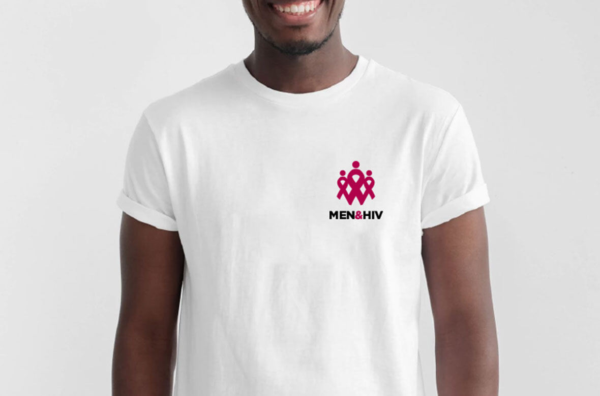 A man wearing a white T-shirt with the Men & HIV logo