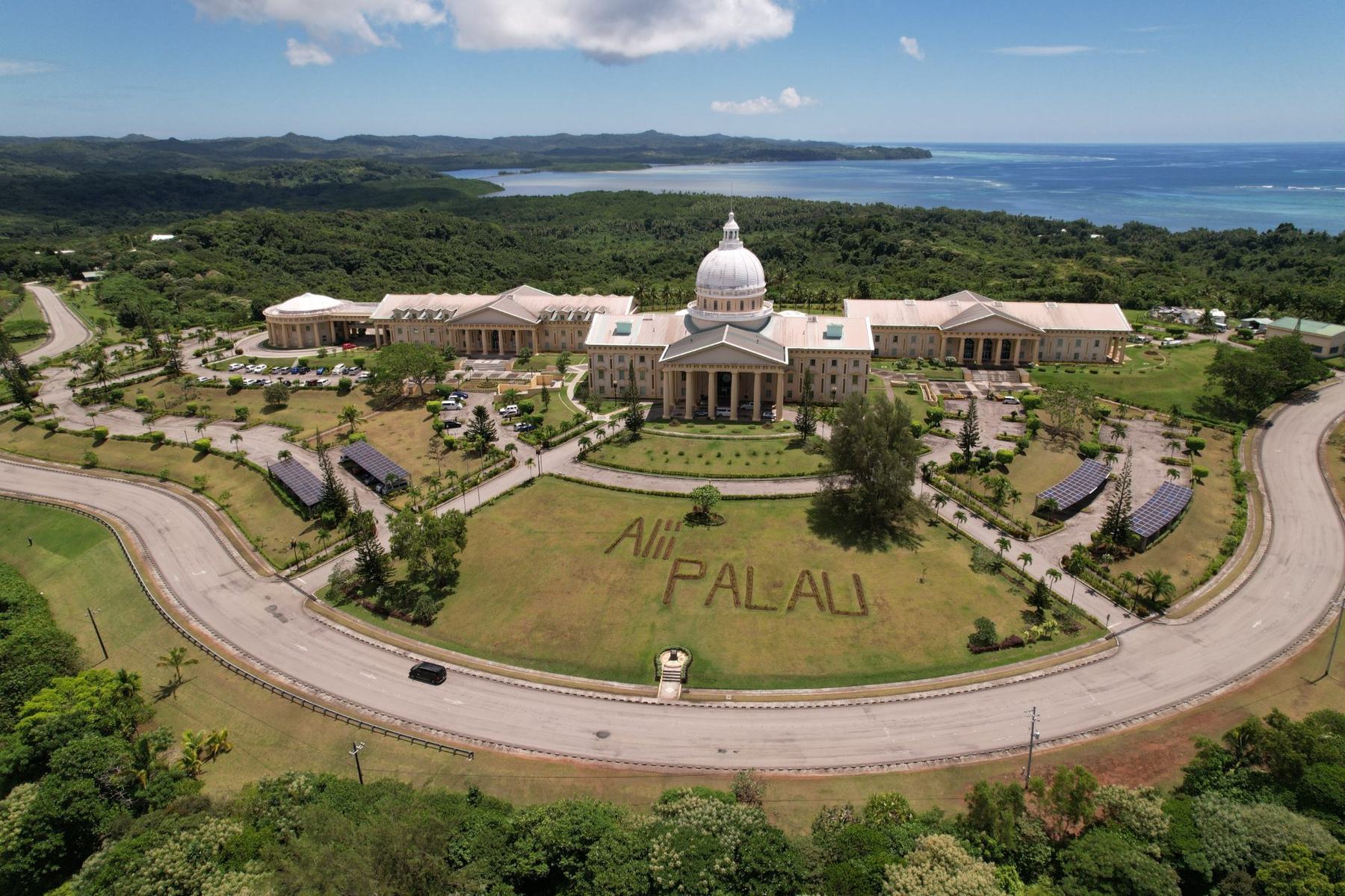 Aerial view of the Palau National Congress at Ngerulmud, with 'Alii Palau' planted on the lawn