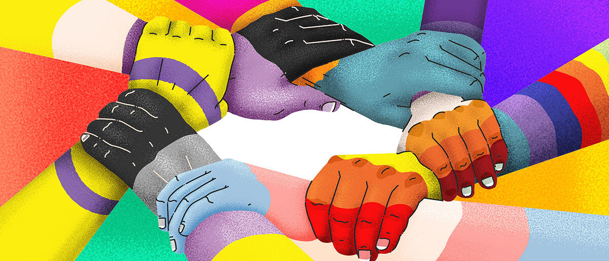 Hands of different skin tones clasped together in a circle