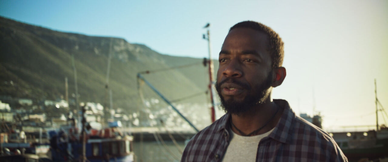 The man standing in Kalk Bay harbour