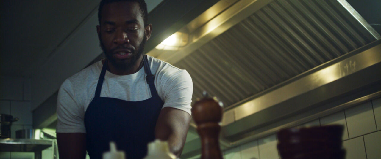 The man working in a restaurant kitchen